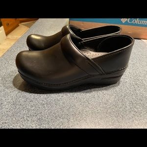 Brand new Dansko waterproof black clogs